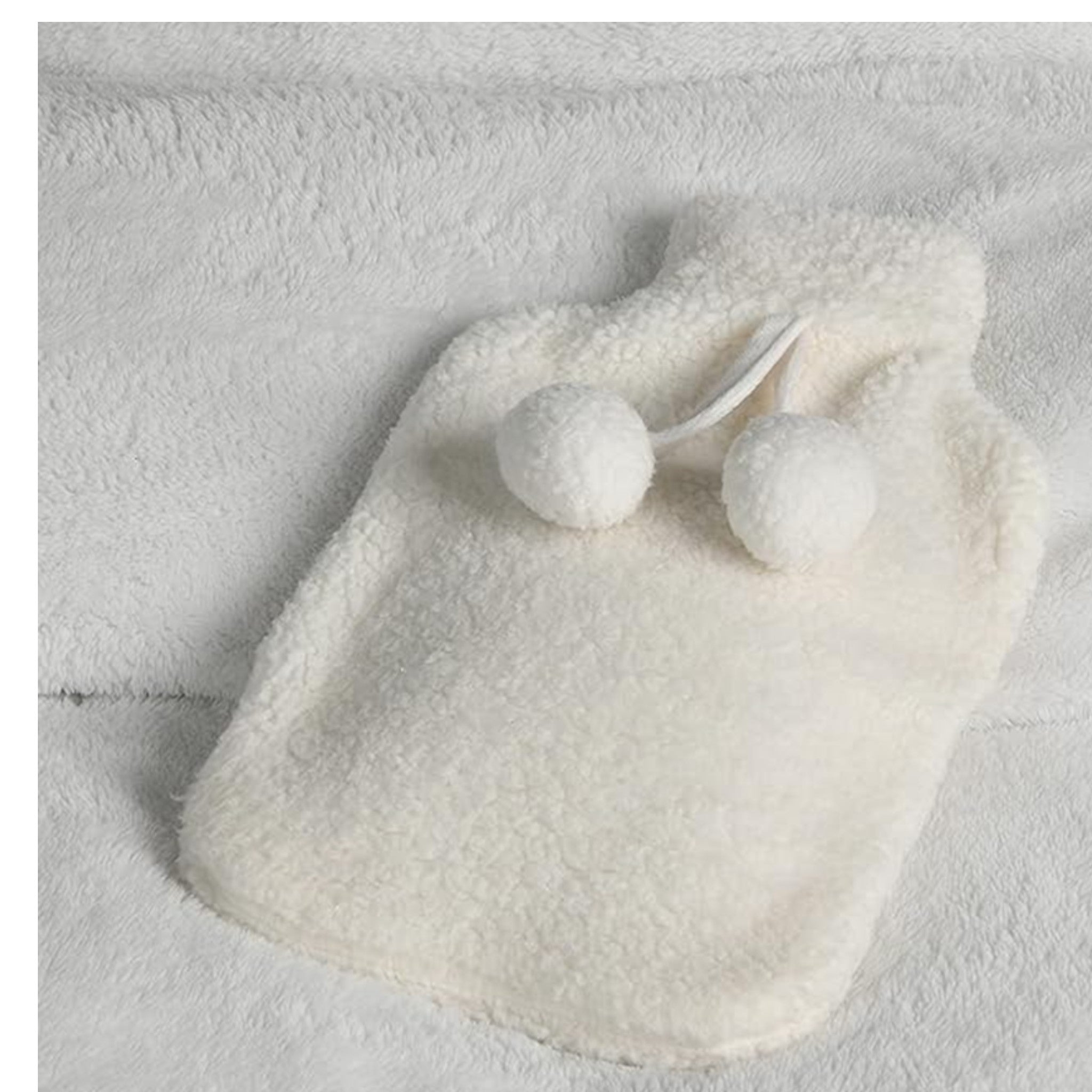 Elite Heat hot water bottle with removable plush cover, perfect for winter in cream white